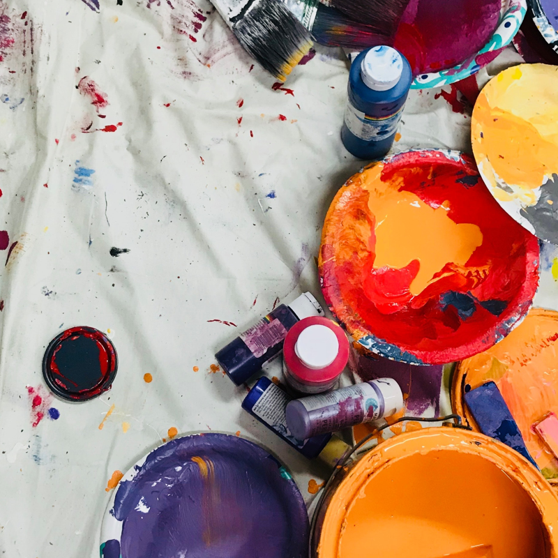 Picture of paint materials laying on a sheet